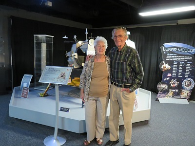 Dorothy and Mac in front of a model Apollo lander